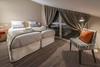 Twin bedroom in the apartments Les Chalets du Jardin Alpin at Independent Ski Links